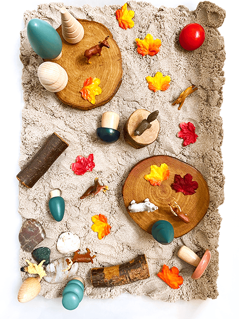 fall sensory table with forest animals